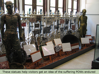Statues let visitors know of the POW's sufferings